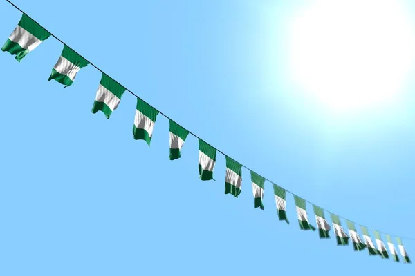 Abbastanza molte bandiere Nigeria o striscioni pende diagonale su corda su sfondo cielo blu con messa a fuoco morbida - qualsiasi bandiera celebrazione 3d illustrazione — Foto Stock