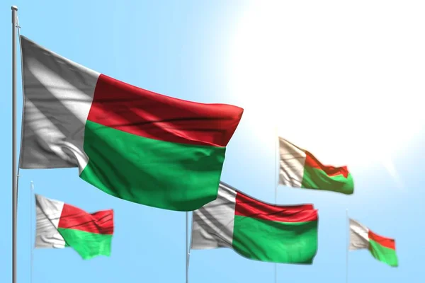 nice 5 flags of Madagascar are wave against blue sky illustration with selective focus - any holiday flag 3d illustration