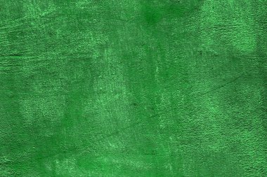 Kırık boya dokusuna sahip şirin, yeşil, pejmürde bir taş. Soyut fotoğraf arkaplanı.