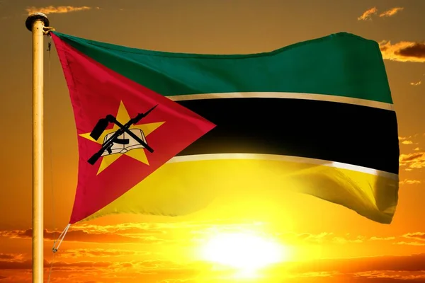 Mozambique flag weaving on the beautiful orange sunset background