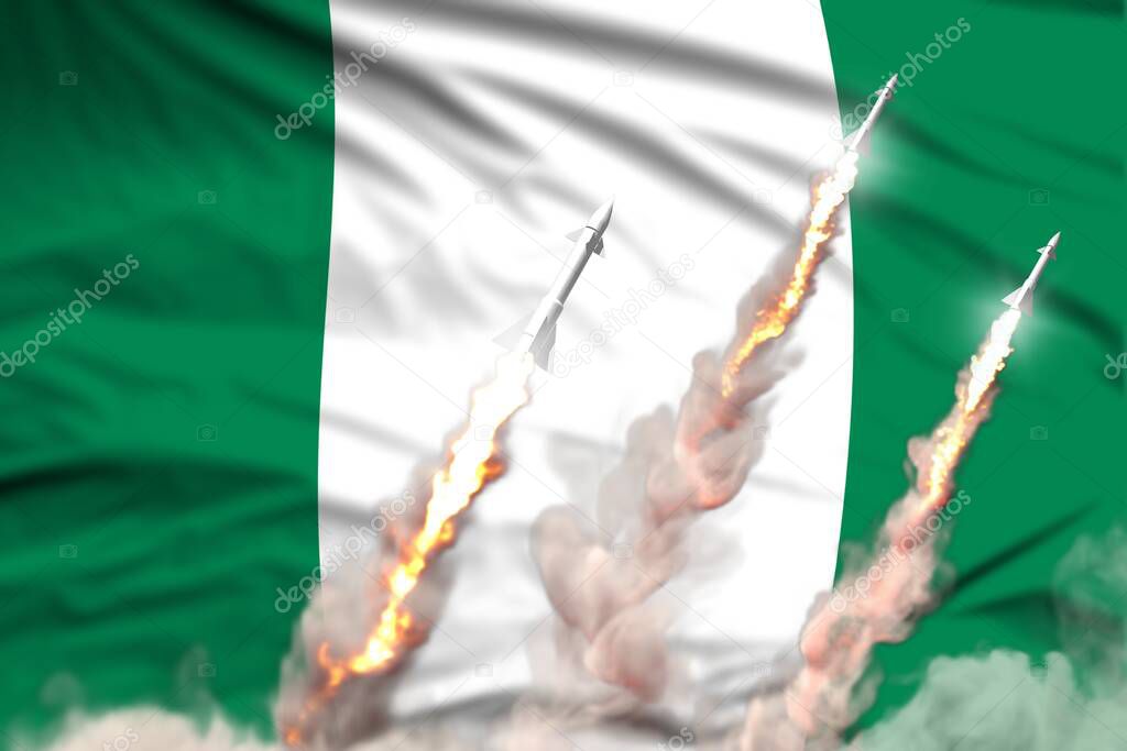 Nigeria nuclear warhead launch - modern strategic nuclear rocket weapons concept on flag fabric background, military industrial 3D illustration with flag