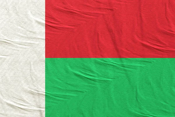 A Madagaszkári Köztársaság zászlót lengetve — Stock Fotó