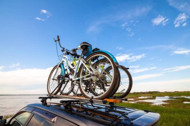 Bicycles on roof racks clipart