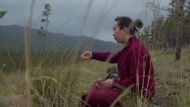 Buddhist Monk Harvesting Medicine Herbs Cloudy Day — 비디오