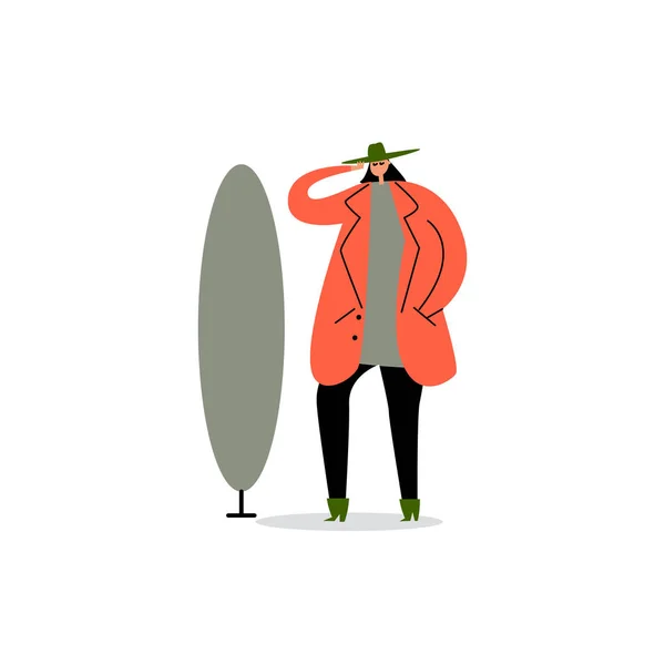 Διάνυσμα εικονογράφηση κινουμένων σχεδίων της γυναίκας κοιτάζοντας στον καθρέφτη και επιλέγοντας καπέλο. — Διανυσματικό Αρχείο