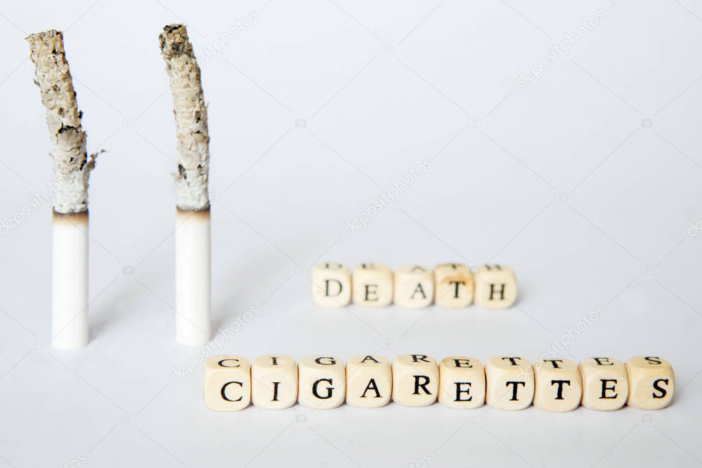 Symbolic picture of death due to cigarette smoking. Inscriptions about cigarettes and death. Agitation for a healthy lifestyle.                          
