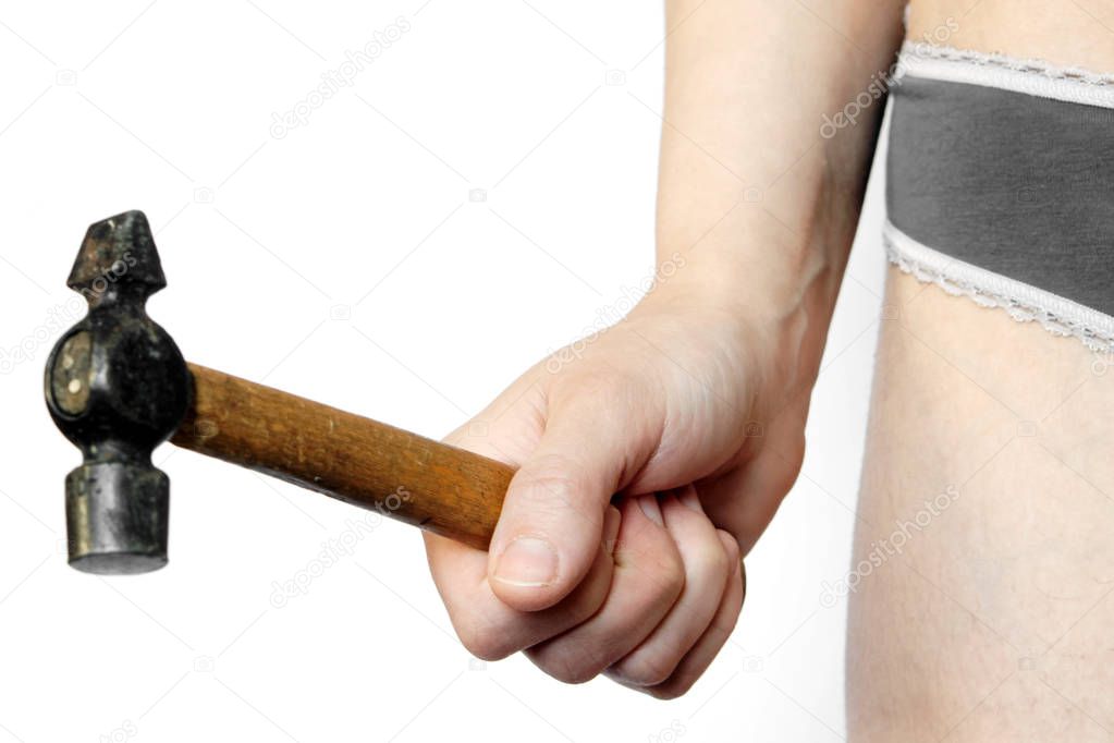 Hammer in female hand on a white background. The problem of domestic violence. Repair work                 