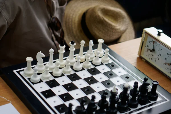 A chess set with special holes for travelers and for the blind i