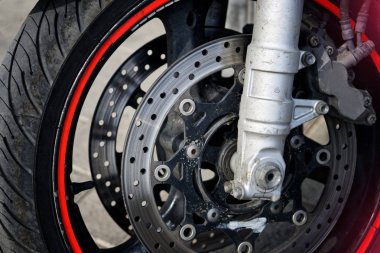 Front wheel and braking mechanism of a biker motorcycle. Road sa