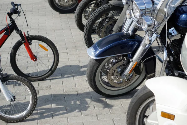 Contrasting and comparing bicycles and motorcycles in the parkin