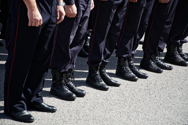 Russian police uniform - army boots in July 2019. Law and order.
