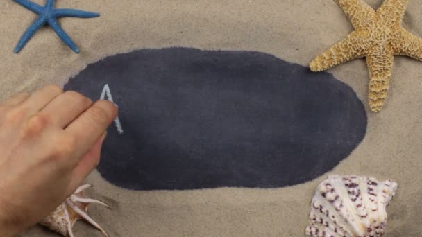 Handwritten word ALANYA written in chalk, among seashells and stars. Top view. — Stock Video