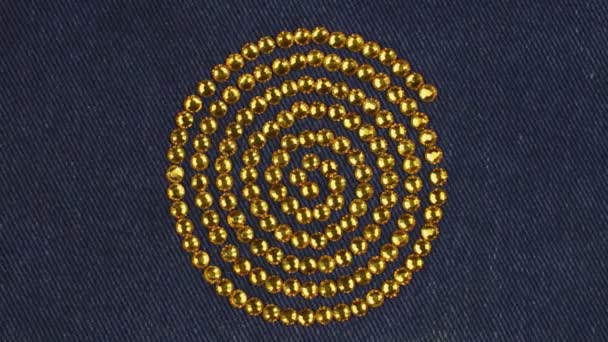 Rotation of a spiral made of yellow rhinestones, the symbol of life force. Top view. — Stock Video