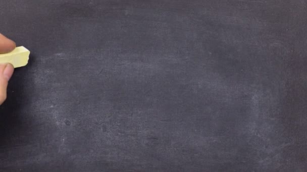 Word FASHION, written by hand in chalk on a blackboard. — Stock Video