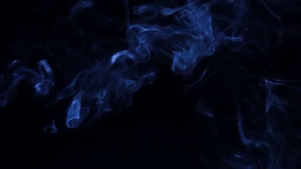 Turbulence blue smoke on a black background. — Stock Video