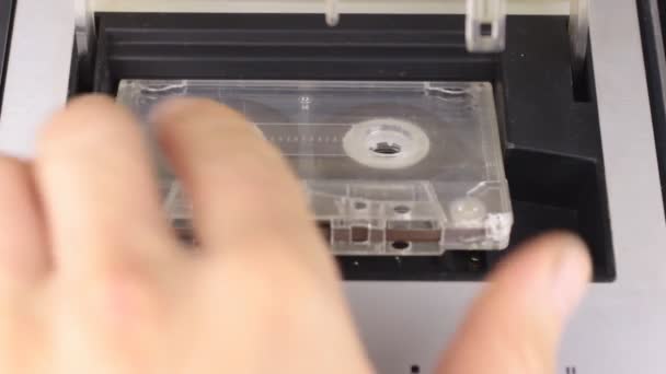 Retro technology. The person stops and ejects the audio tape from the tape recorder. — Stock Video