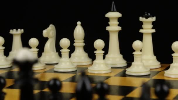 Chess pieces on a chessboard table. Panorama. — Stock Video