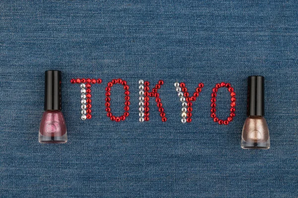 Word Tokyo, made of rhinestones, encrusted on denim. World Fashion. View from above