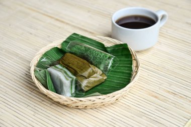 Authentic Bali sweets from rice flour with cup of tea. clipart