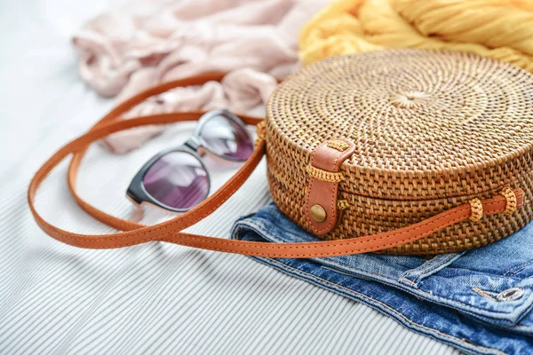 Fashionable Handmade Natural Organic Rattan Bag Clothes Sunglasses Bed Closeup — Stock Photo, Image