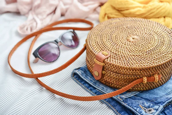Fashionable Handmade Natural Organic Rattan Bag Clothes Sunglasses Bed Closeup — Stock Photo, Image