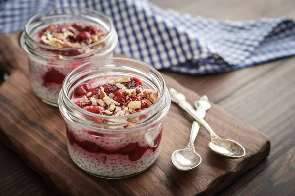 Chia Pudding Cherry Almond Glass Jars Wooden Background Closeup — Stock Photo, Image