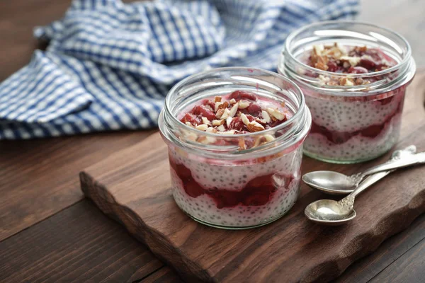 Chia Pudding Cherry Almond Glass Jars Wooden Background Closeup — Stock Photo, Image