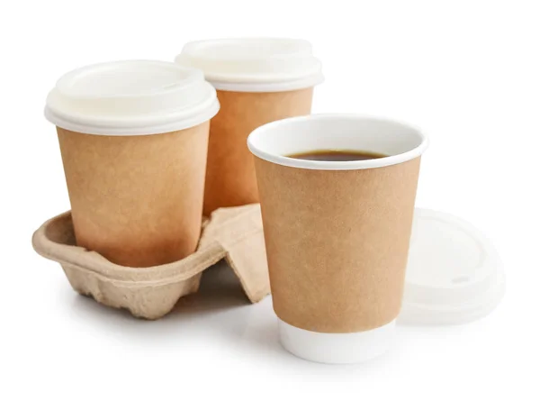 Tazas desechables para llevar con café en el titular —  Fotos de Stock