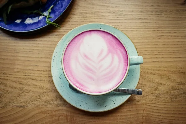 Cup of pink cappuccino — Stock Photo, Image