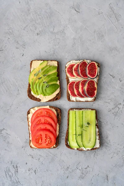 Vegetarian sandwich with cucumber, tomato, figs and avocado