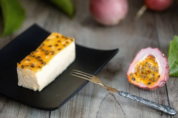 Passion Fruits Cheese Cake Slice Dark Plate — Stock Photo, Image