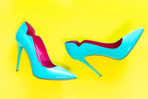 Blue High Heels Glassy Shoes Yellow Background Top View — Stock Photo, Image