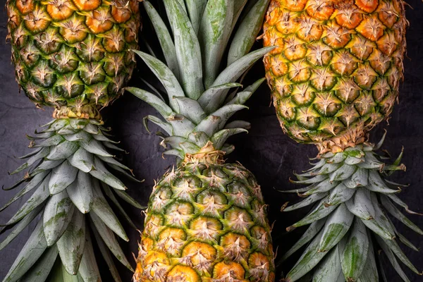 Close Three Ripe Fresh Pineapples Dark Background Top View — Stock Photo, Image