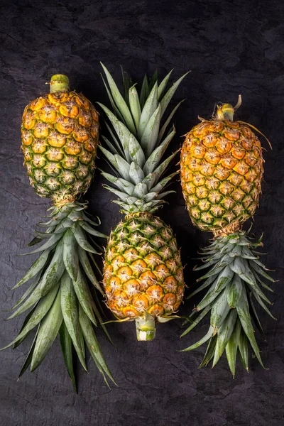 Three Fresh Ripe Pineapple Dark Background Vertical Composition Top View — Stock Photo, Image