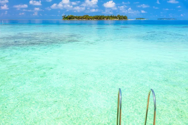 Idyllic blue marine landscape over horizon on tropical island