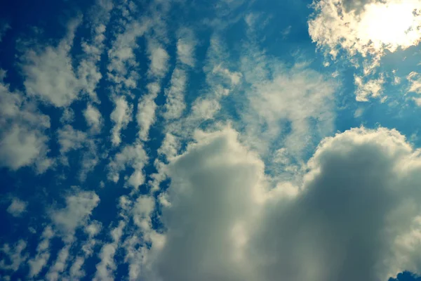 Clouds against a blue-green sky or ocean 002