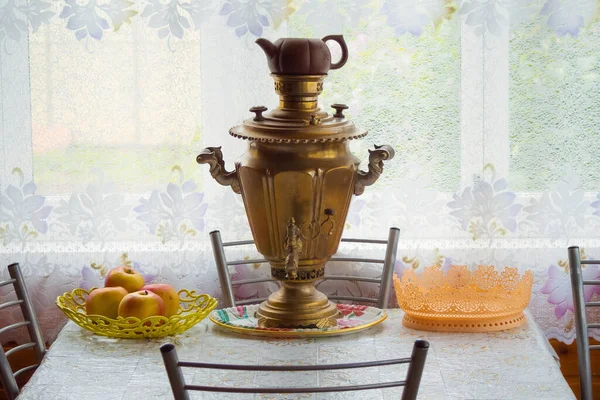 Samovar on the table indoor on the veranda of a country house - rural scene