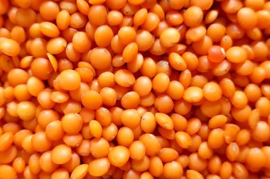 Kırmızı mercimek yakın plan. Bir sürü mercimeği olan bir arka plan..