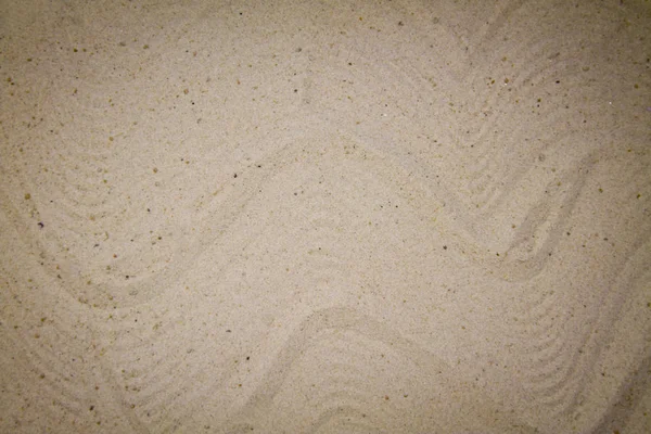Uzavřete písek krásnou hladkou texturu na pláži v letním slunci. — Stock fotografie