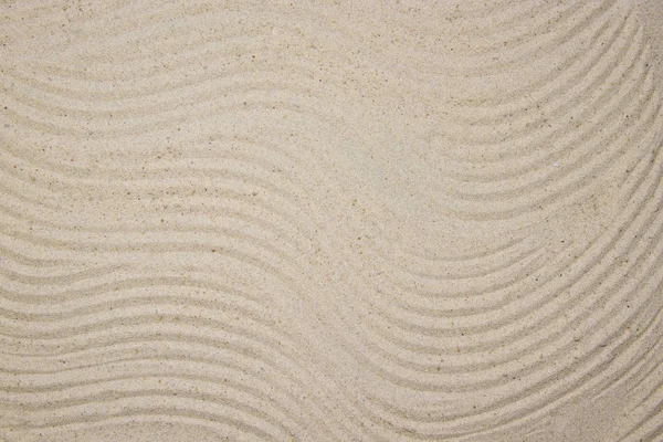 Uzavřete písek krásnou hladkou texturu na pláži v letním slunci. — Stock fotografie
