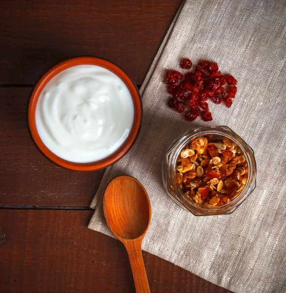 Granola in bowl and yogurt — Stock Photo, Image