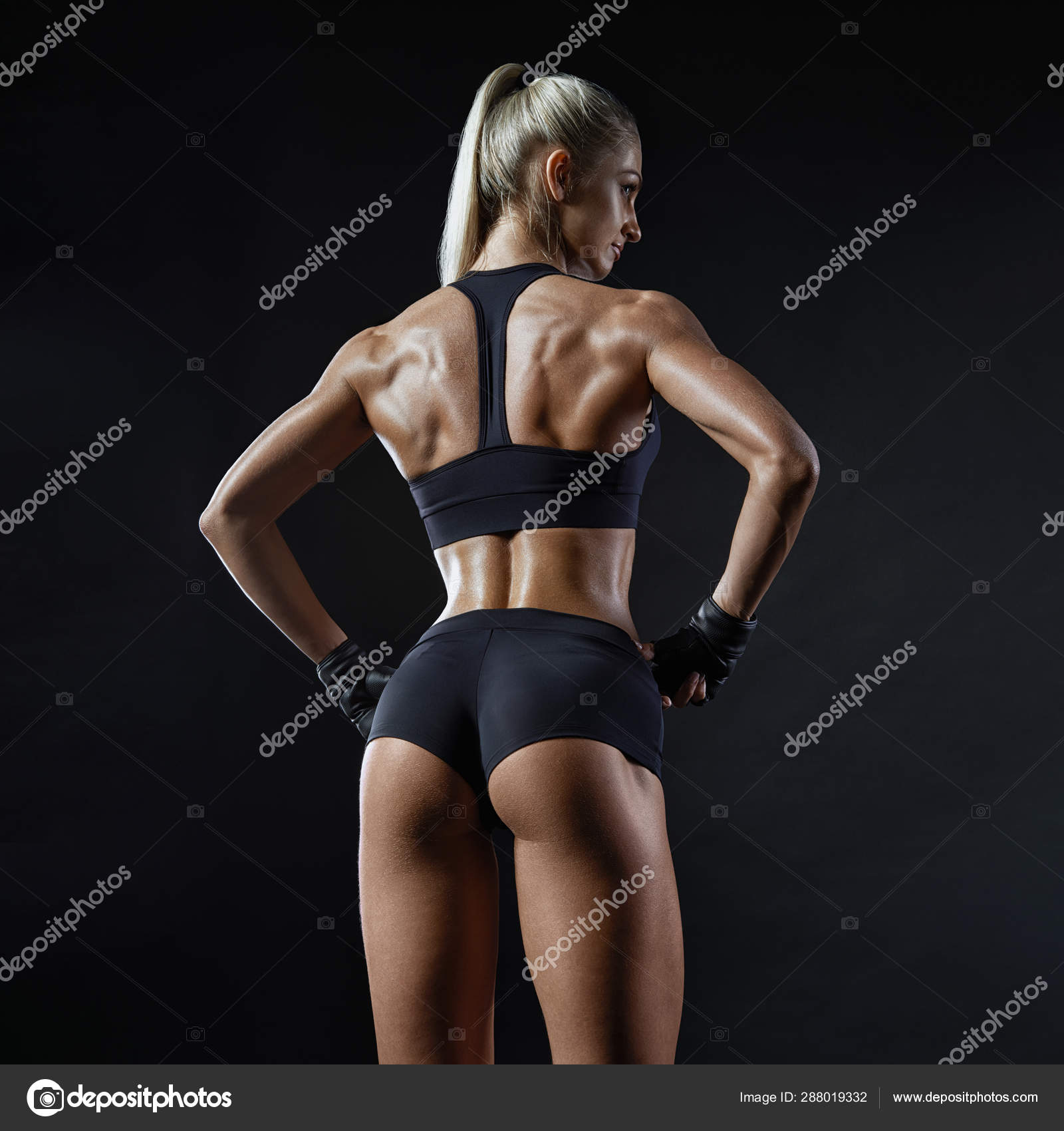 Fitness model turned back with her hands at waist Stock Photo by  ©Improvisor 288019332