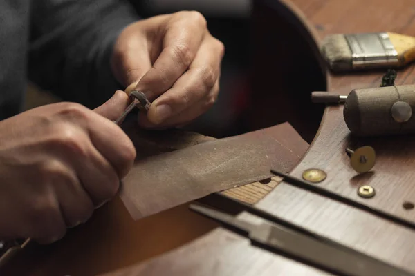 Golden ring and craftsman jewelry tools — Stock Photo, Image