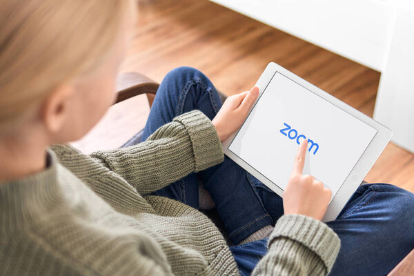January 5, 2020, Kaliningrad, Russia. A little girl using Zoom mobile app to join a meeting from her iPad.