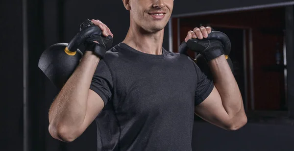 Handsome athletic guy workout with kettlebell — Stock Photo, Image