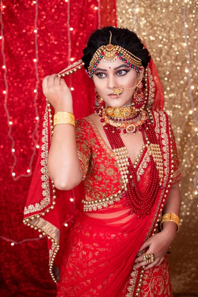 Pakistani Indian bride showing wedding lehenga sharara design , Indian wedding dress and jewelry