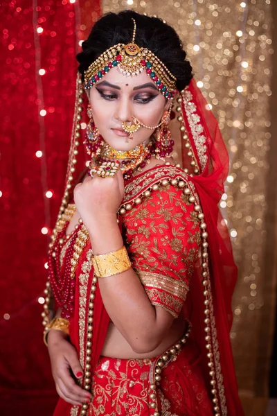 Pakistani Indian bride showing wedding lehenga sharara design , Indian wedding dress and jewelry