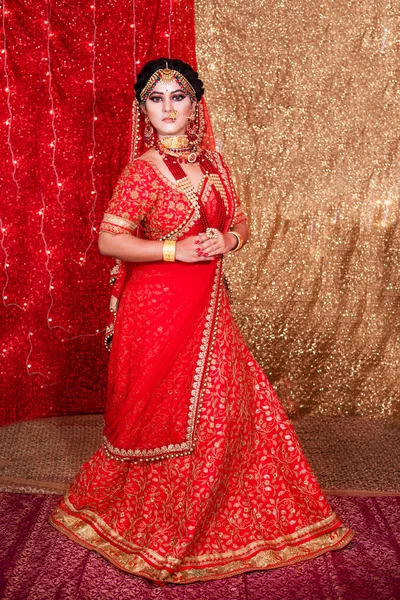 Pakistani Indian bride showing wedding lehenga sharara design , Indian wedding dress and jewelry