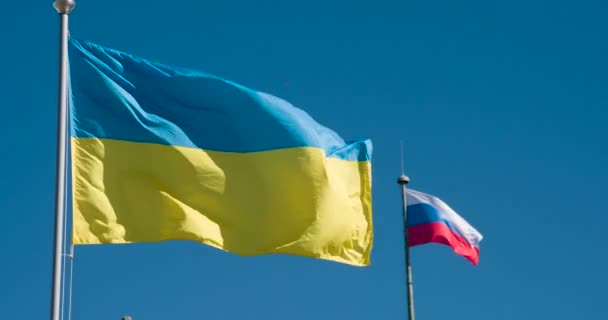 Flags Ukraine Russia Two Flags Conflicting States Flying Blue Sky — Stock Video