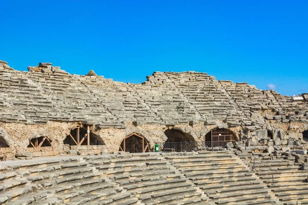 The ruins of the ancient Roman city of Side in Turkey. The remains of buildings, theater and other infrastructure of the ancient city. Historical monuments of ancient Greek and Roman eras.